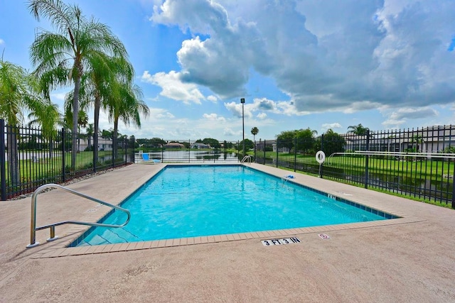 7115 39th Ln E, Sarasota, FL 34243 - community pool featuring a patio area