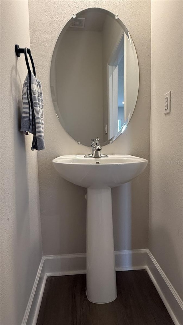 14312 Crimson Ave, Bradenton, FL 34211 - bathroom featuring baseboards and wood finished floors