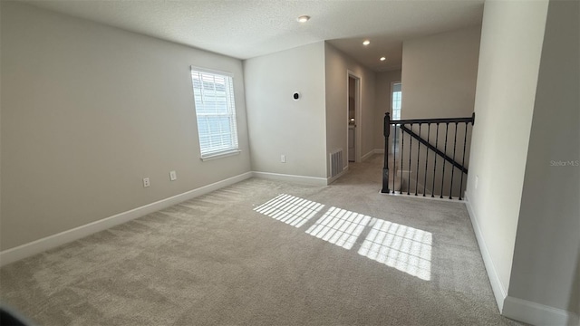 14312 Crimson Ave, Bradenton, FL 34211 - carpeted spare room with plenty of natural light, recessed lighting, and a textured ceiling