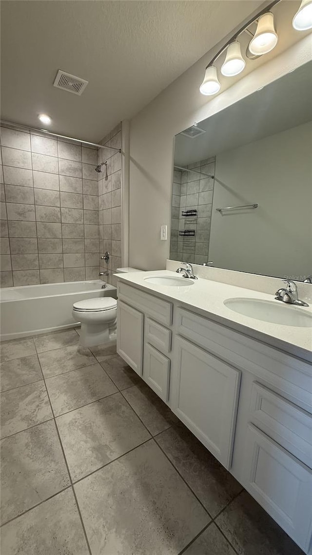 14312 Crimson Ave, Bradenton, FL 34211 - bathroom featuring double vanity, washtub / shower combination, and tile patterned floors