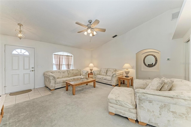 7824 48th Pl E, Bradenton, FL 34203 - carpeted living room featuring lofted ceiling, ceiling fan, and tile patterned flooring