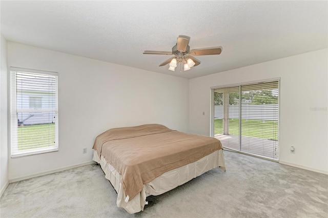 7824 48th Pl E, Bradenton, FL 34203 - bedroom featuring access to outside, carpet, and a ceiling fan