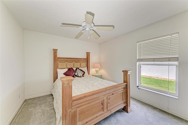7824 48th Pl E, Bradenton, FL 34203 - bedroom with light carpet and a ceiling fan