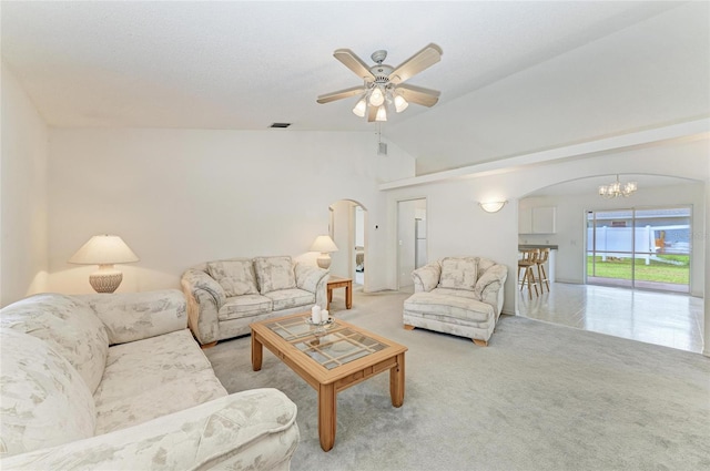 7824 48th Pl E, Bradenton, FL 34203 - living area with arched walkways, a chandelier, ceiling fan, vaulted ceiling, and carpet