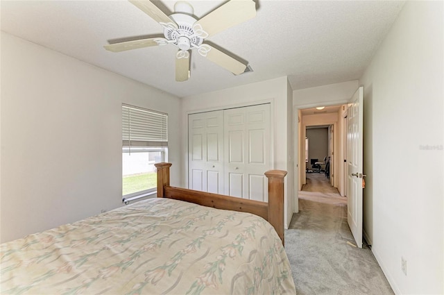 7824 48th Pl E, Bradenton, FL 34203 - bedroom with light carpet, a closet, and ceiling fan