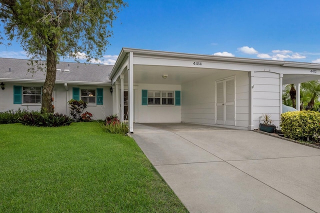 4414 Mount Vernon Dr Unit 1, Bradenton, FL 34210 - single story home with a front lawn, a carport, concrete driveway, and stucco siding