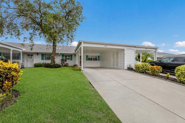 4414 Mount Vernon Dr Unit 1, Bradenton, FL 34210 - ranch-style house with an attached carport, concrete driveway, and a front yard
