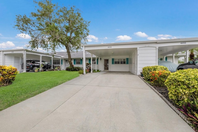 4414 Mount Vernon Dr Unit 1, Bradenton, FL 34210 - single story home featuring an attached carport, a front lawn, and driveway