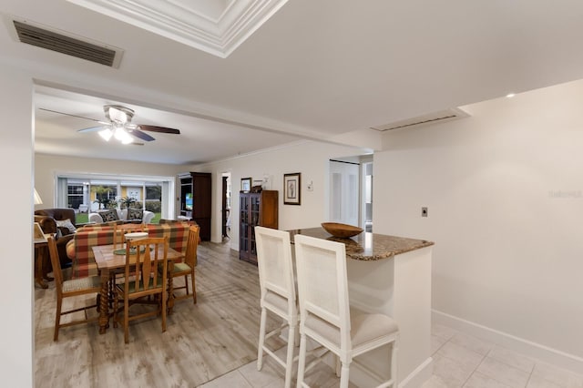 4414 Mount Vernon Dr Unit 1, Bradenton, FL 34210 - dining space with crown molding and light tile patterned flooring