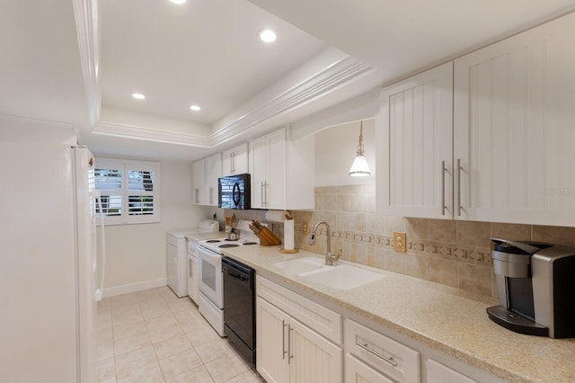 4414 Mount Vernon Dr Unit 1, Bradenton, FL 34210 - kitchen with black appliances, a tray ceiling, light tile patterned floors, light countertops, and white cabinets