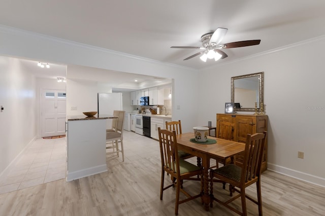 4414 Mount Vernon Dr Unit 1, Bradenton, FL 34210 - dining space with ornamental molding, a ceiling fan, and light wood-type flooring