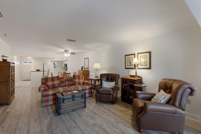 4414 Mount Vernon Dr Unit 1, Bradenton, FL 34210 - living room with light wood-style floors, ceiling fan, and ornamental molding