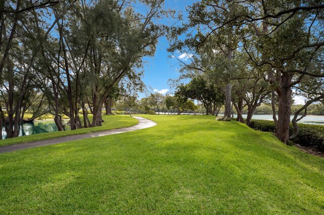 4414 Mount Vernon Dr Unit 1, Bradenton, FL 34210 - view of community featuring a water view and a lawn