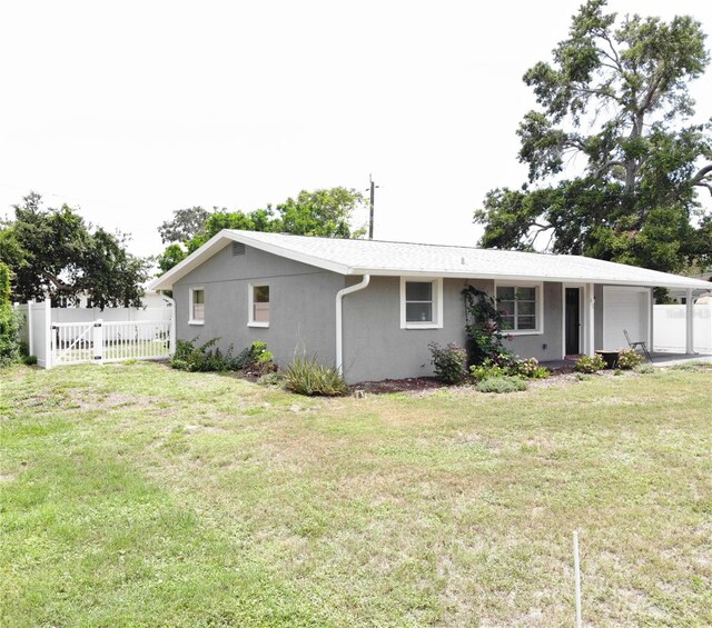 611 Missouri Rd, Venice, FL 34293 - view of front of property with an attached garage and stucco siding