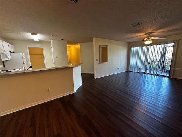 4002 Crockers Lake Blvd Unit 11, Sarasota, FL 34238 - unfurnished living room featuring a textured ceiling, dark wood finished floors, and ceiling fan