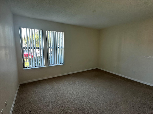 4002 Crockers Lake Blvd Unit 11, Sarasota, FL 34238 - unfurnished room with carpet floors and a textured ceiling