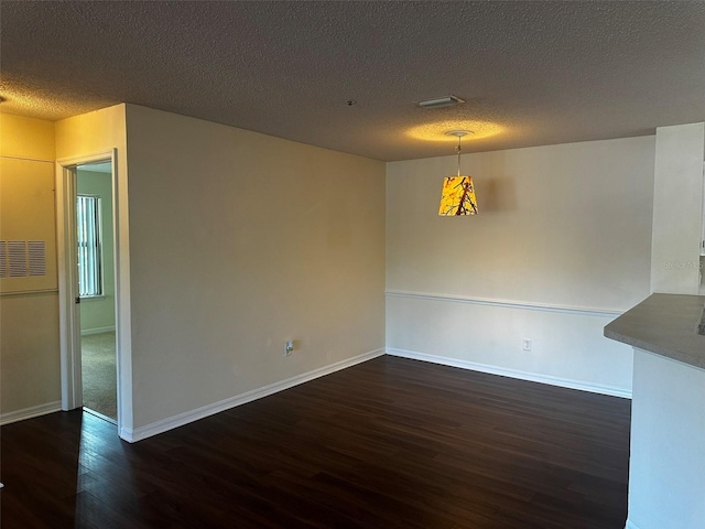 4002 Crockers Lake Blvd Unit 11, Sarasota, FL 34238 - unfurnished dining area with wood finished floors and a textured ceiling
