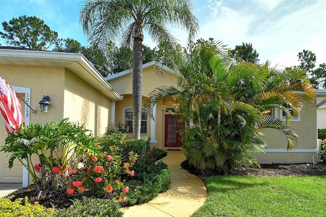 12113 Whistling Way, Lakewood Ranch, FL 34202 - doorway to property featuring stucco siding