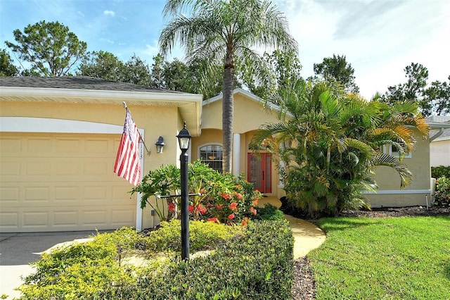 12113 Whistling Way, Lakewood Ranch, FL 34202 - view of front facade with a garage and stucco siding