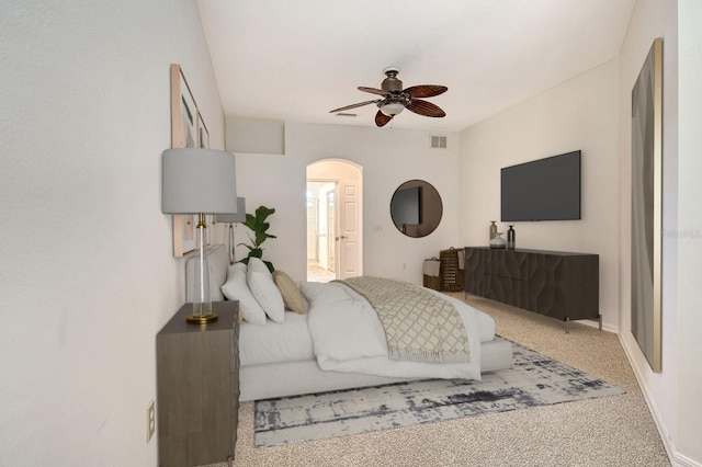 12113 Whistling Way, Lakewood Ranch, FL 34202 - bedroom with arched walkways, carpet flooring, and ceiling fan