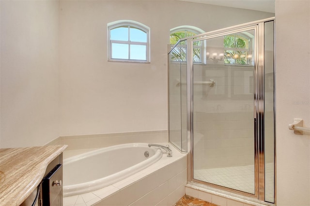 12113 Whistling Way, Lakewood Ranch, FL 34202 - full bath featuring a garden tub, a stall shower, and vanity