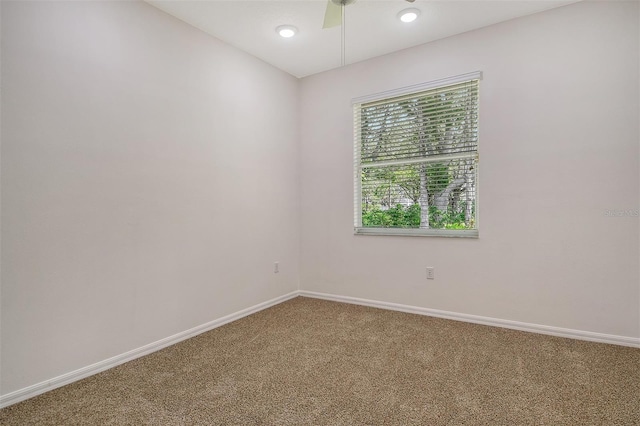 12113 Whistling Way, Lakewood Ranch, FL 34202 - spare room featuring carpet and a ceiling fan