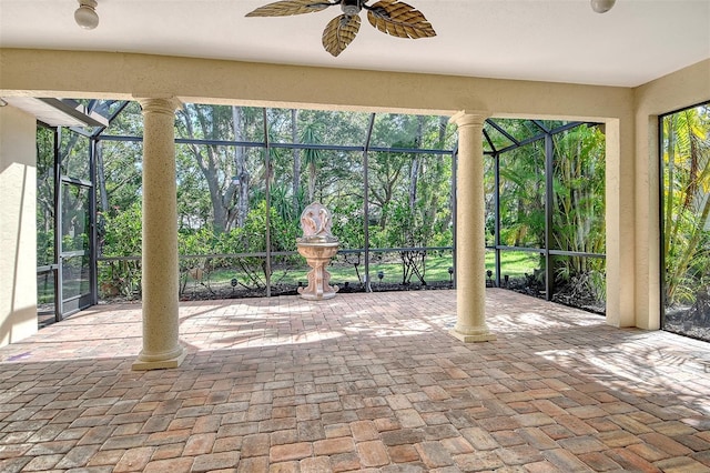 12113 Whistling Way, Lakewood Ranch, FL 34202 - unfurnished sunroom with view of scattered trees