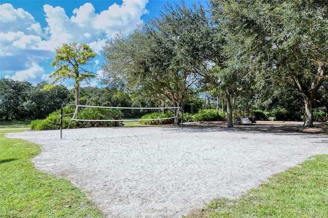 12113 Whistling Way, Lakewood Ranch, FL 34202 - view of home's community featuring volleyball court, view of wooded area, and a yard