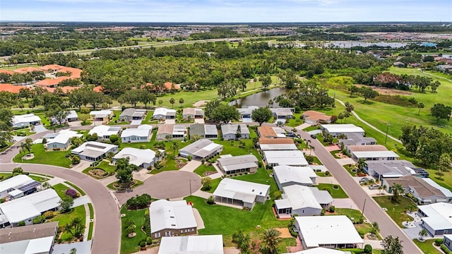 8470 Imperial Cir, Palmetto, FL 34221 - aerial perspective of suburban area featuring a golf course and a nearby body of water