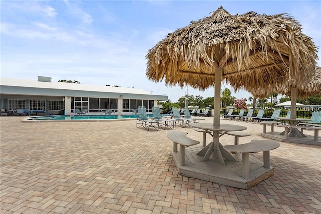 8470 Imperial Cir, Palmetto, FL 34221 - community pool with a patio and a sunroom