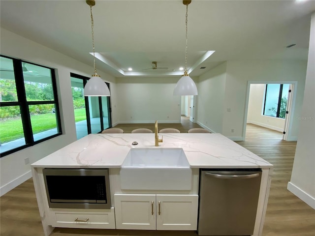 3616 Bellefonte Ave, North Port, FL 34286 - kitchen with appliances with stainless steel finishes, open floor plan, light wood finished floors, and healthy amount of natural light