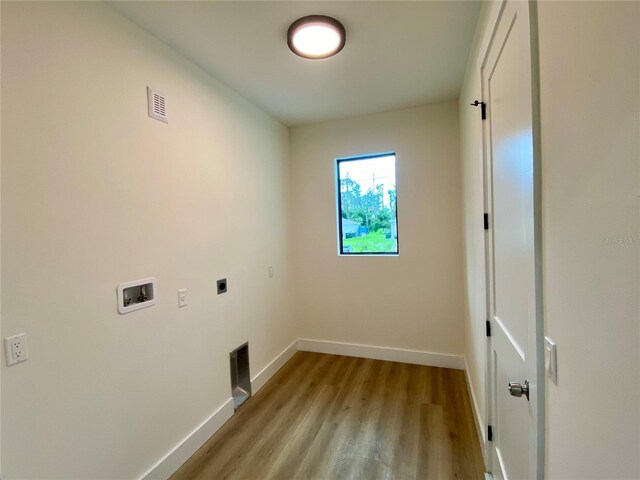3616 Bellefonte Ave, North Port, FL 34286 - washroom featuring electric dryer hookup, hookup for a washing machine, and light wood-style floors