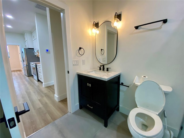 3616 Bellefonte Ave, North Port, FL 34286 - bathroom featuring vanity, wood finished floors, and recessed lighting
