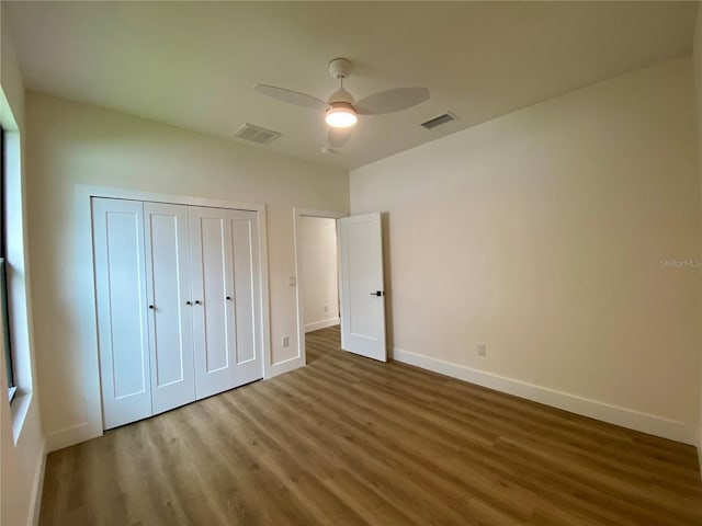 3616 Bellefonte Ave, North Port, FL 34286 - unfurnished bedroom featuring wood finished floors, a closet, and ceiling fan