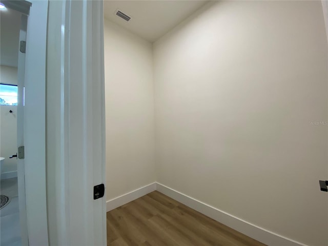 3616 Bellefonte Ave, North Port, FL 34286 - laundry area featuring wood finished floors and baseboards