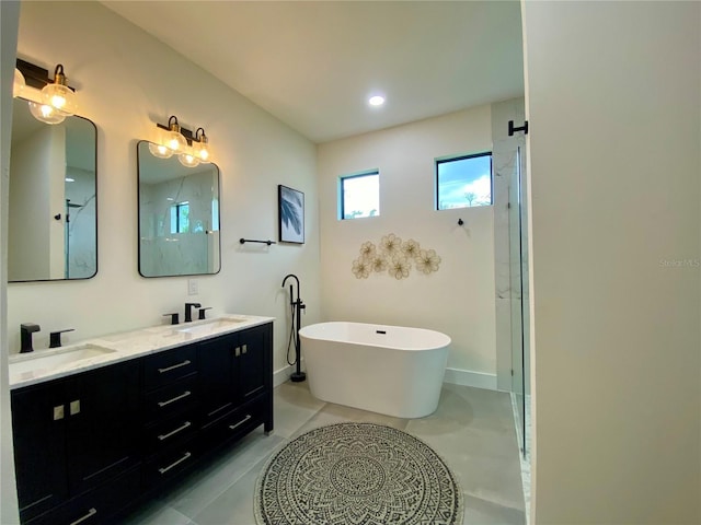 3616 Bellefonte Ave, North Port, FL 34286 - full bathroom featuring a freestanding bath, double vanity, and a shower