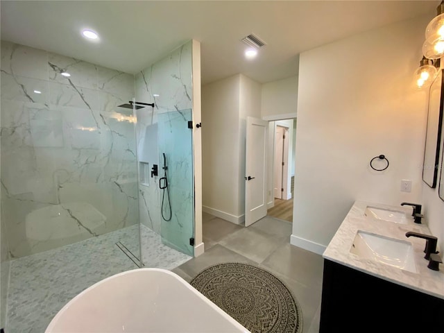 3616 Bellefonte Ave, North Port, FL 34286 - full bathroom featuring a marble finish shower, a freestanding bath, double vanity, and recessed lighting