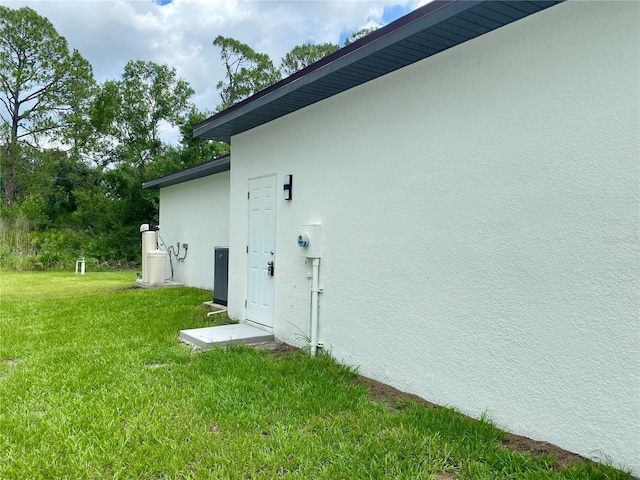 3616 Bellefonte Ave, North Port, FL 34286 - doorway to property with stucco siding and a yard