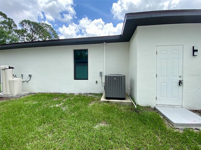 3616 Bellefonte Ave, North Port, FL 34286 - property entrance with stucco siding and a lawn
