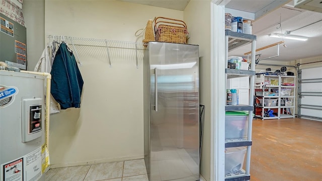 5524 Antilles Dr, Sarasota, FL 34231 - garage with stainless steel fridge and electric water heater