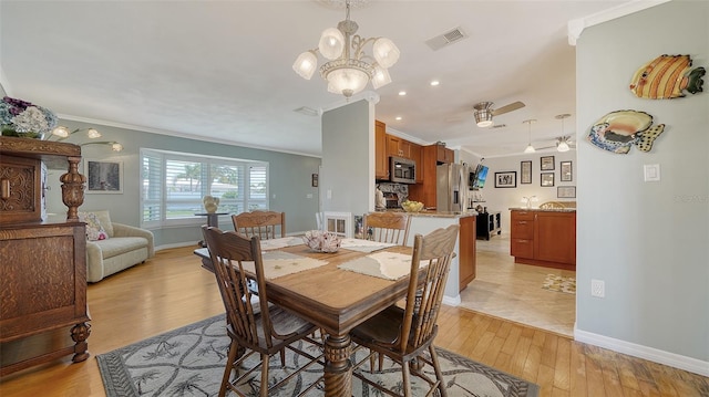 5524 Antilles Dr, Sarasota, FL 34231 - dining room with ornamental molding, light wood finished floors, ceiling fan, recessed lighting, and a chandelier