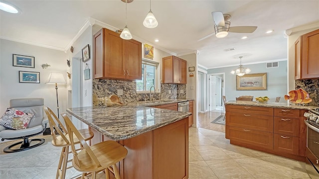 5524 Antilles Dr, Sarasota, FL 34231 - kitchen featuring a peninsula, crown molding, tasteful backsplash, a kitchen breakfast bar, and ceiling fan
