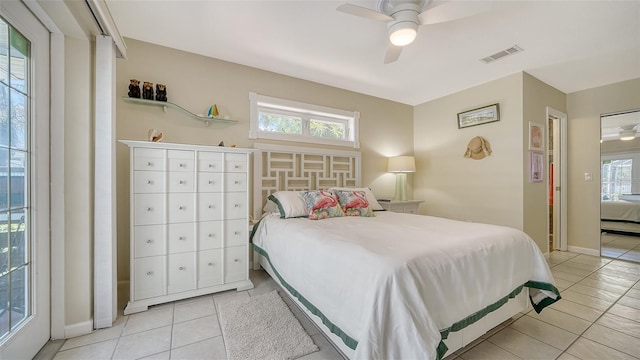 5524 Antilles Dr, Sarasota, FL 34231 - bedroom featuring light tile patterned floors, multiple windows, and ceiling fan
