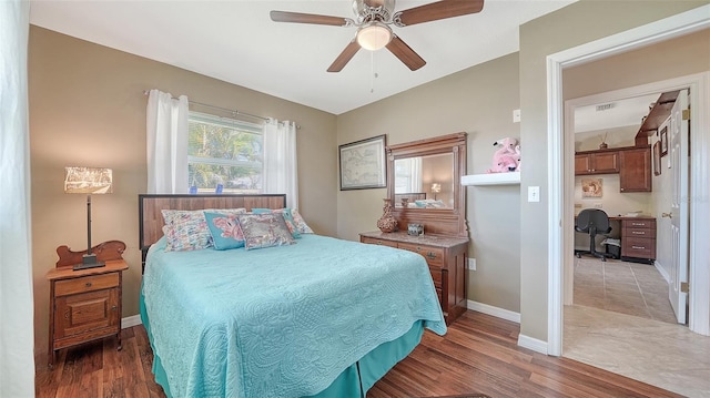5524 Antilles Dr, Sarasota, FL 34231 - bedroom with an office area, light wood-style floors, and a ceiling fan