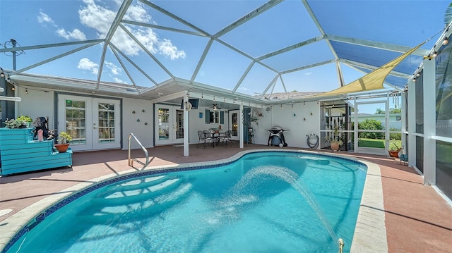 5524 Antilles Dr, Sarasota, FL 34231 - swimming pool featuring french doors, a patio area, ceiling fan, and glass enclosure