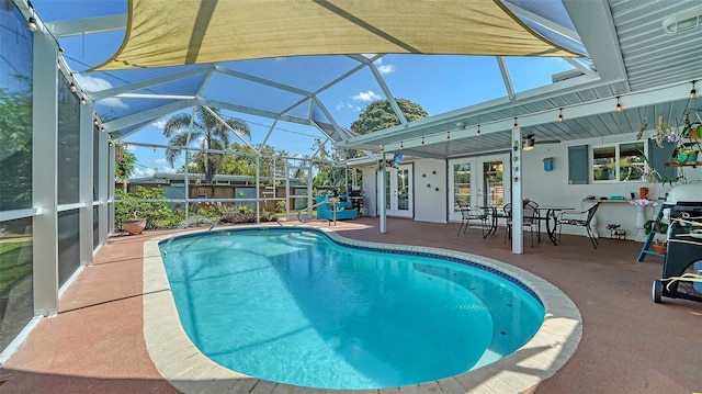 5524 Antilles Dr, Sarasota, FL 34231 - outdoor pool with french doors, a patio area, and a lanai