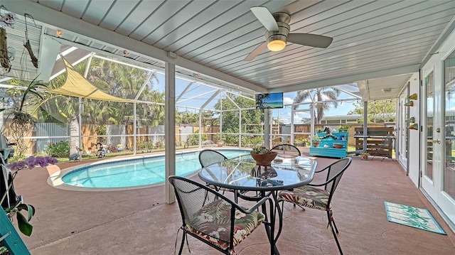 5524 Antilles Dr, Sarasota, FL 34231 - view of swimming pool with a fenced backyard, a patio, glass enclosure, and ceiling fan