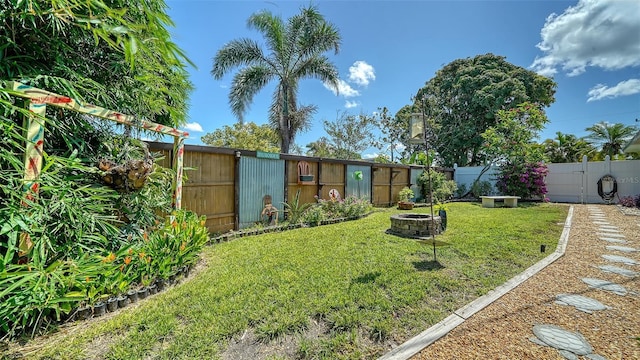 5524 Antilles Dr, Sarasota, FL 34231 - fenced backyard with an outdoor fire pit