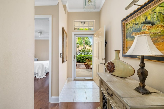 2411 New Haven Cir Unit 70, Sun City Center, FL 33573 - entrance foyer featuring ornamental molding and wood finished floors