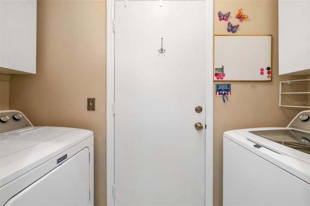 2411 New Haven Cir Unit 70, Sun City Center, FL 33573 - washroom featuring cabinet space and separate washer and dryer